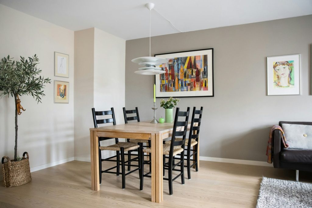 A dining room with a table and chairs
