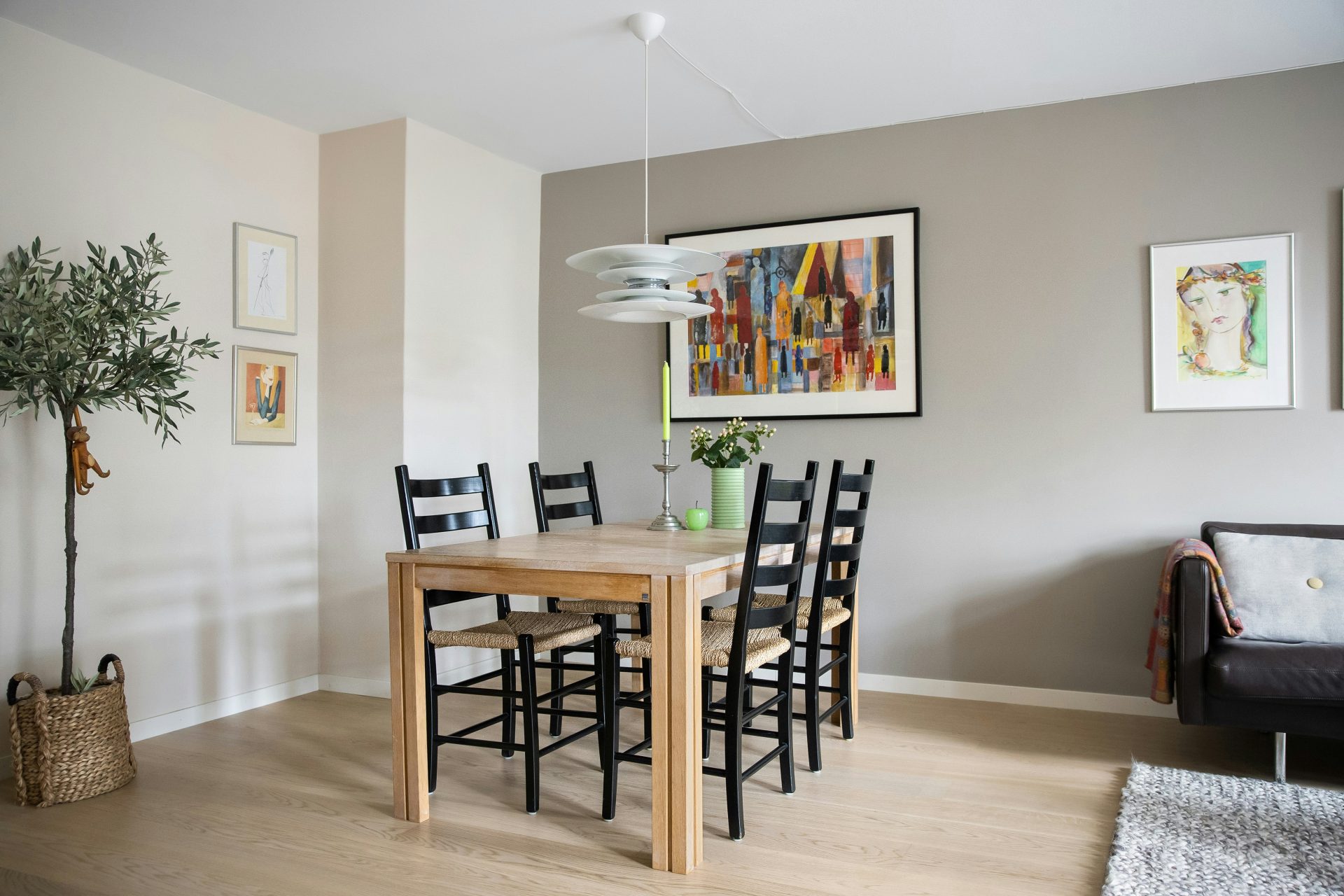 A dining room with a table and chairs